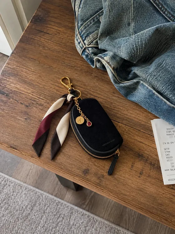 Lifestyle imagery: Styled Black Mini on an entryway bench