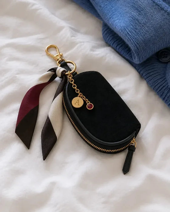 Lifestyle imagery: Styled Black Mini on soft bed linen