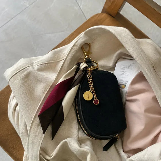 Lifestyle imagery: Styled Black Mini beside a canvas tote