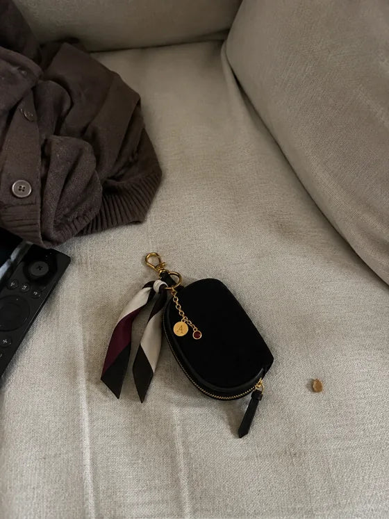 Lifestyle imagery: Styled Black Mini on a sofa
