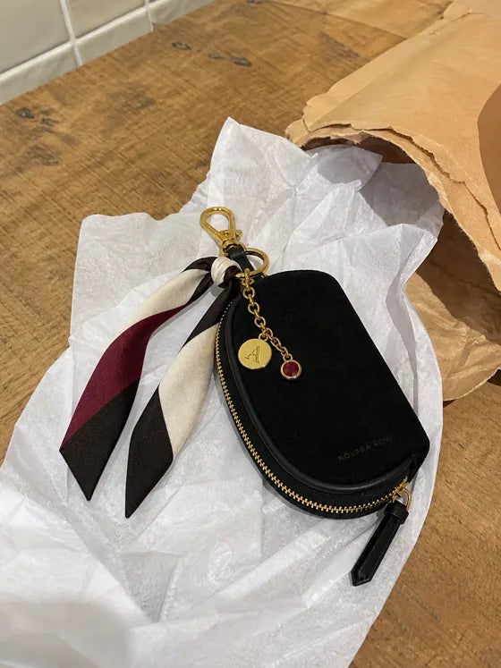 Lifestyle imagery: Styled Black Mini beside a plain opened mailer