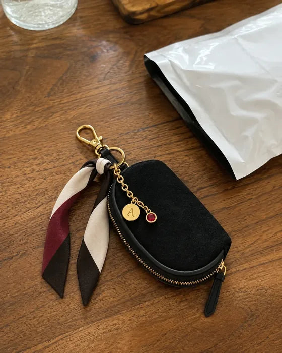 Lifestyle imagery: Styled Black Mini beside an opened mailer