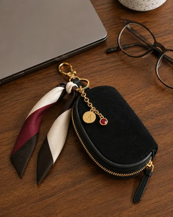 Lifestyle imagery: Styled Black Mini beside a laptop on a desk