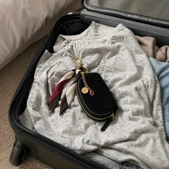 Lifestyle imagery: Styled Black Mini with a suitcase