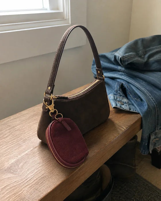 Lifestyle imagery: Oxblood Mini attached to the Linea 12 in an entryway